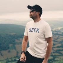 Featuring the signature navy "Adventure" graphic arranged inside a bold triangular shape, this 100% organic cotton tee delivers comfort and style for outdoor lovers. Shown here in our vintage white colorway with a flattering unisex fit.