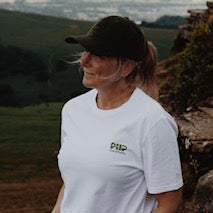 100% organic white Seek Adventure T Shirt with green logo