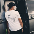 Organic white t-shirt featuring minimalist coordinates graphic on the front, designed by Peak 2 Paddle. Lightweight, eco-friendly fabric with a relaxed fit — inspired by nature and adventure.